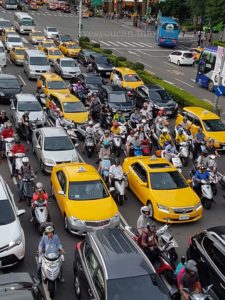 Pole position traffic in Taiwan. Taxis, cars and scooters sharing the road in Taipei